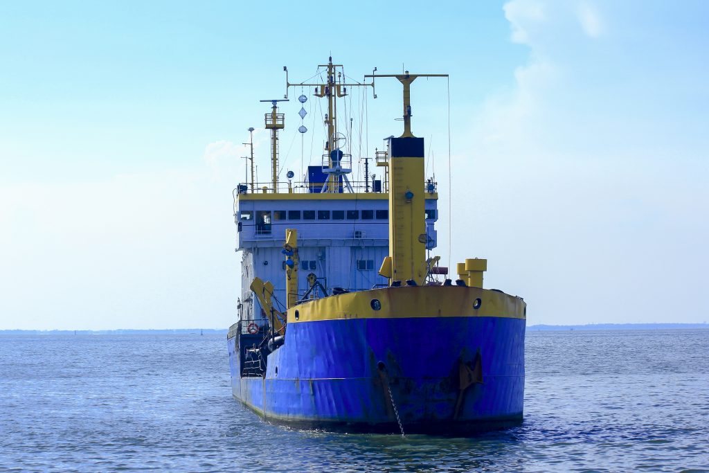 A cargo ship with the colours of the swedish flag